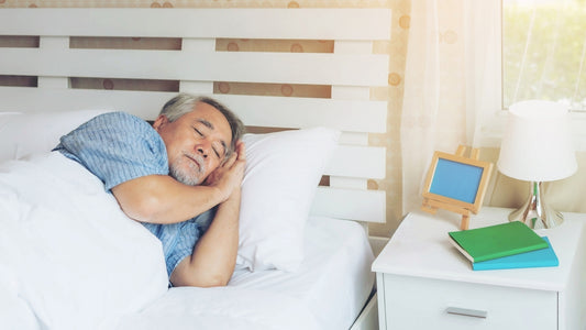 Senior male , old man sleeping on the pillow on white bed room in the morning.